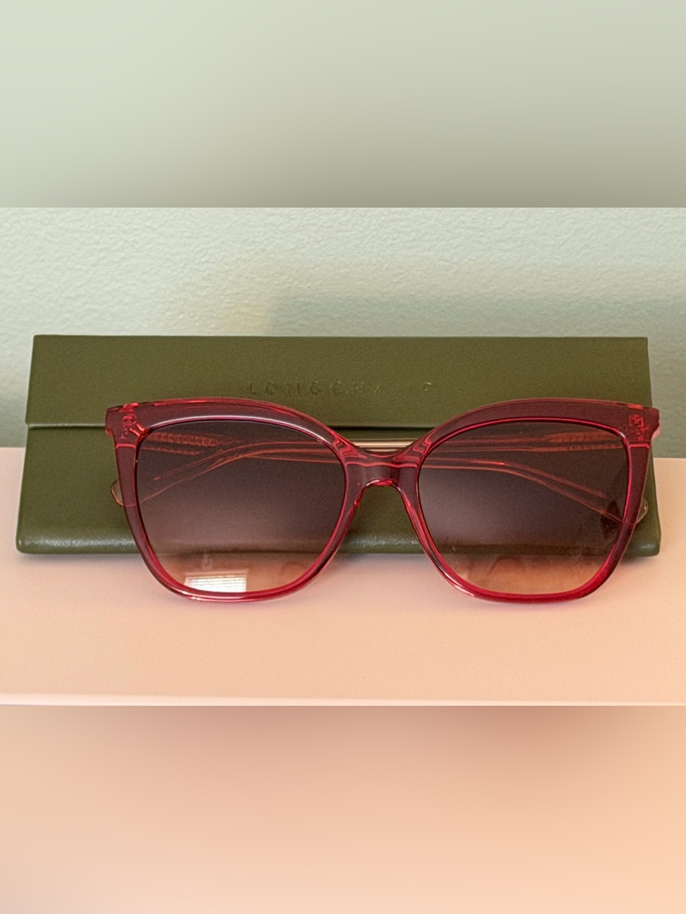Longchamp LO729S sunglasses w/ red/ fuchsia rose frame.